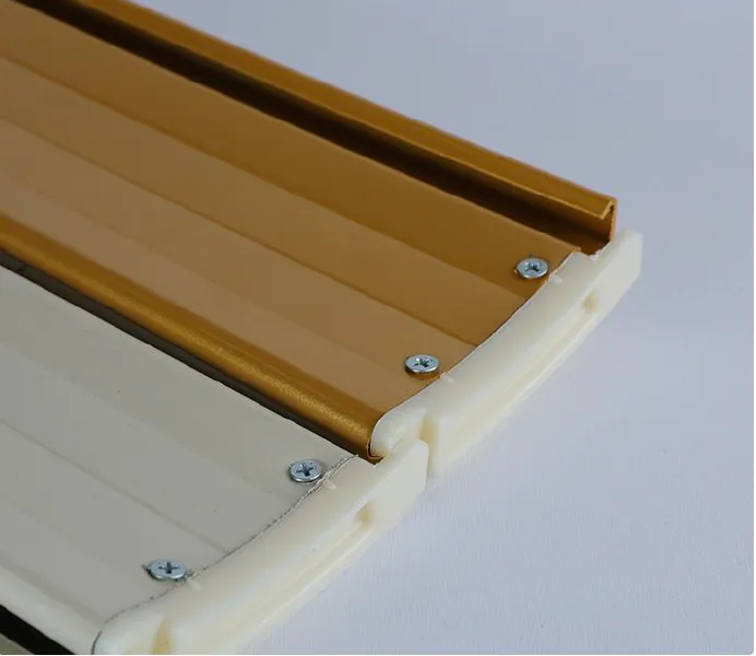 End cap securing slats within the rail